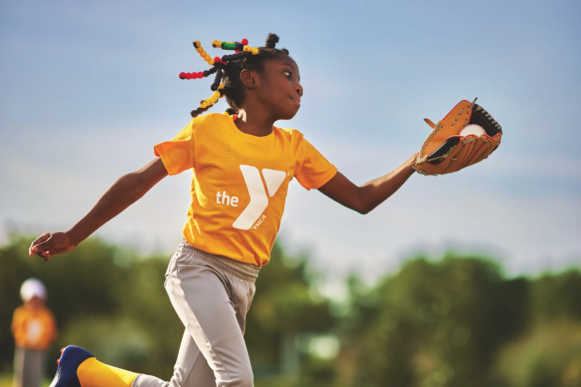Girl catching softball at the Y