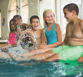 Kids splashing in pool