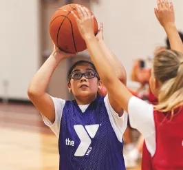 Girls playing youth basketball at the YMCA